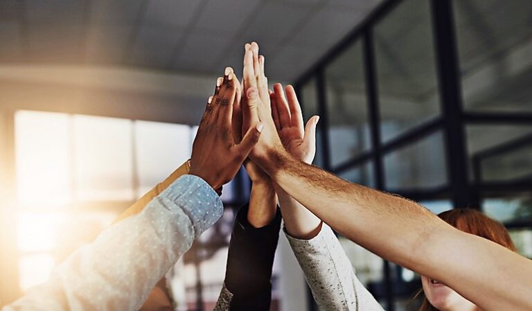 group high-fiving