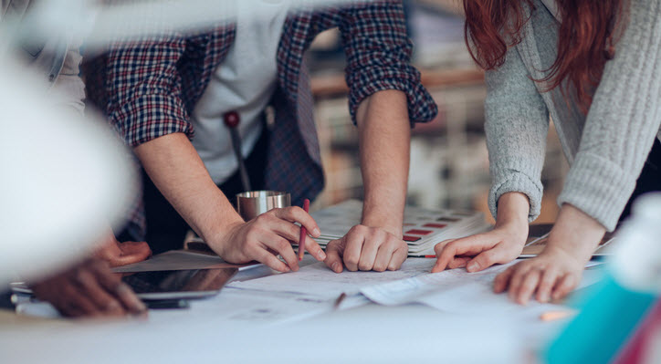 people working on a logo design