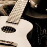 sepia toned image of accoustic guitar
