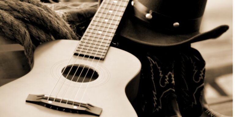 sepia toned image of accoustic guitar
