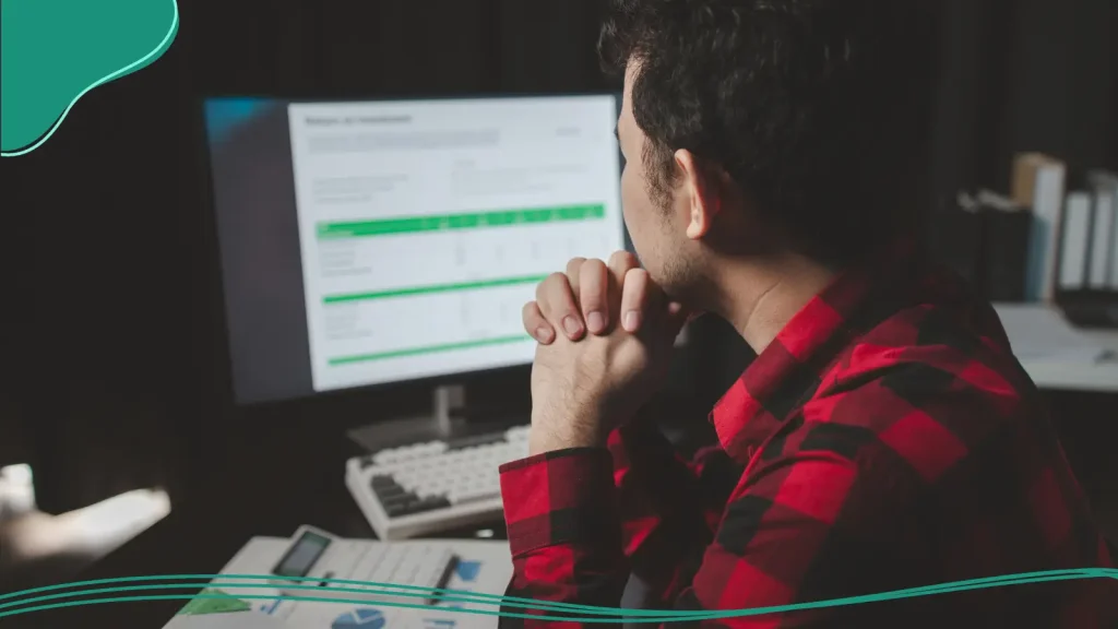 Person checking technical considerations on a computer