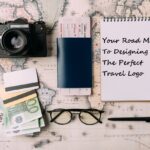 passport, camera, notepad, money on world map