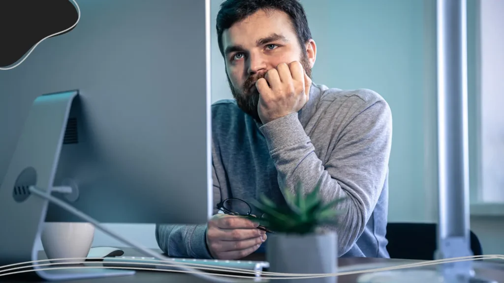Bored man at a computer 