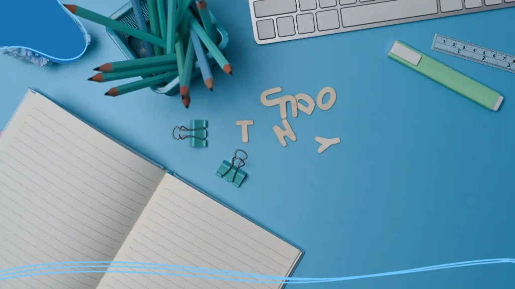 Notebook, pencils, and letters on a desk