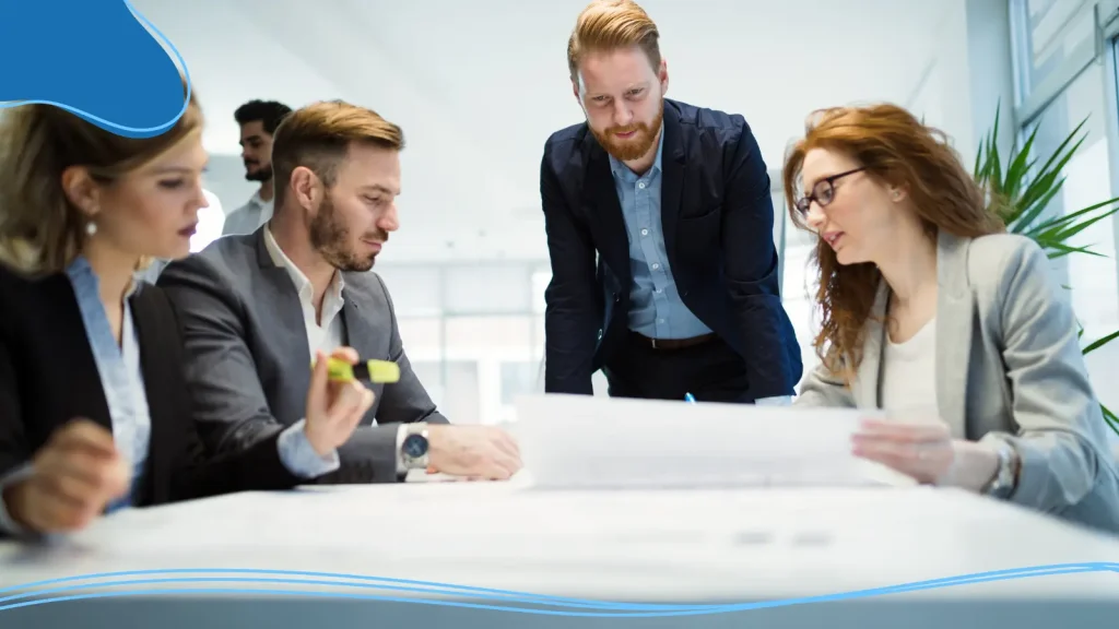 Group of businesspeople looking at a document