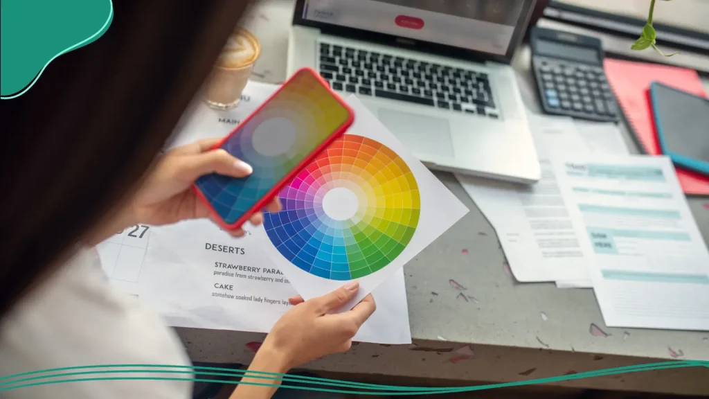 Person taking a picture of a color wheel