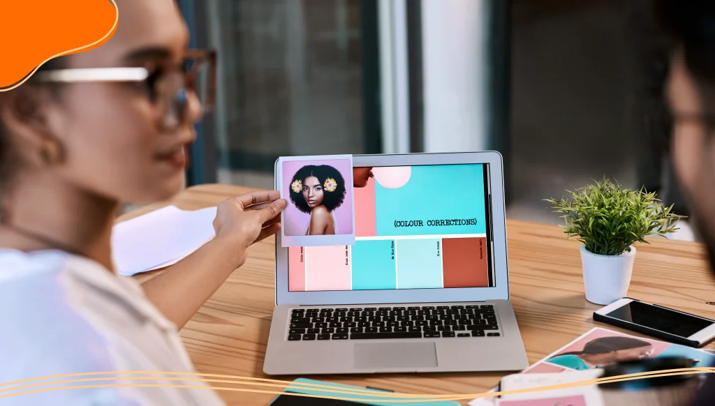 Two people looking at color options on a laptop