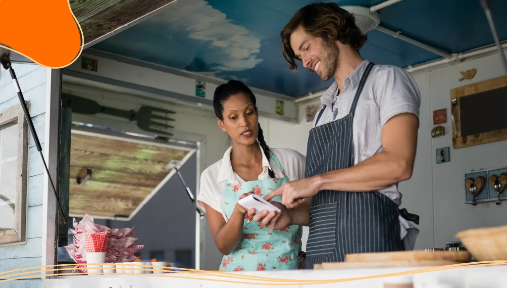 Waiter and waitress interacting with each other