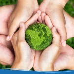Hands holding a green earth