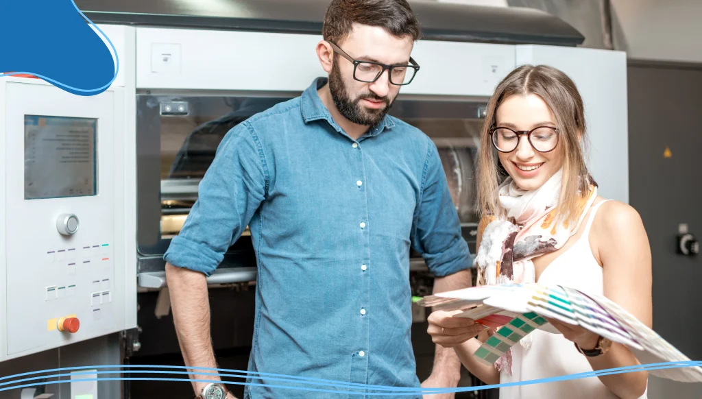 Woman with print operator at the manufacturing plant