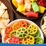 Bowls of different colorful snacks