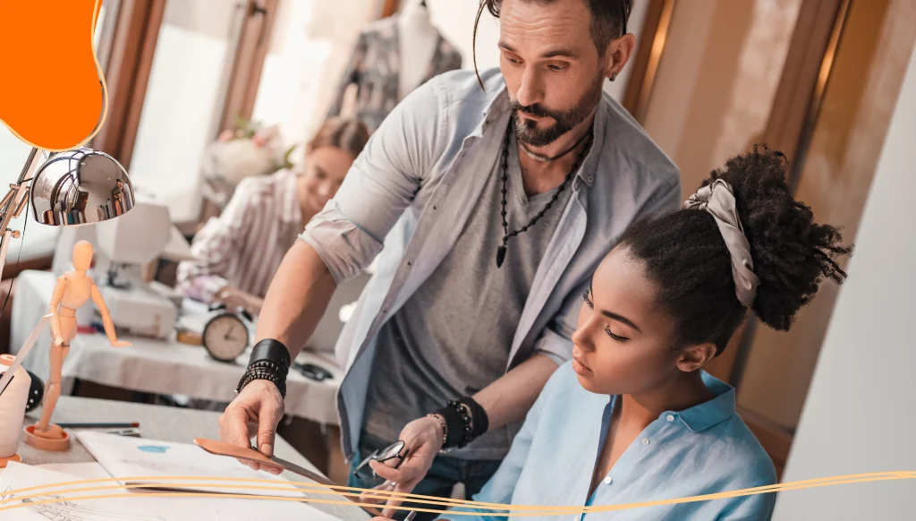 Cropped photo of group of three people at design studio