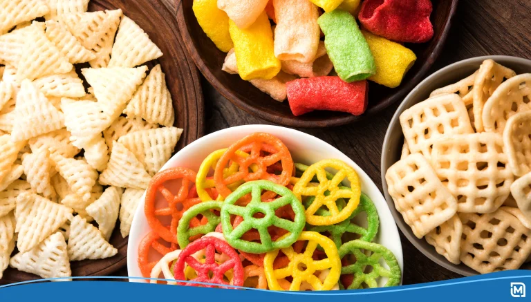 Bowls of different colorful snacks
