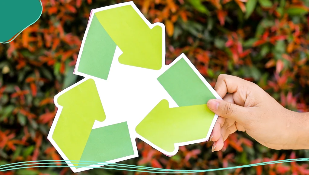 Close Up Of Two Hands Holding Plastic Bottle And Recycle Sign