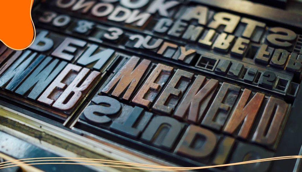 Detail shot of wooden letterpress letters in print workshop