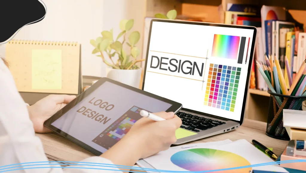 Graphic designer working on a tablet and computer
