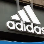 Adidas logo with the three stripes outside of a store
