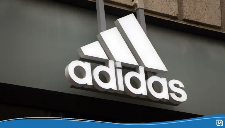 Adidas logo with the three stripes outside of a store
