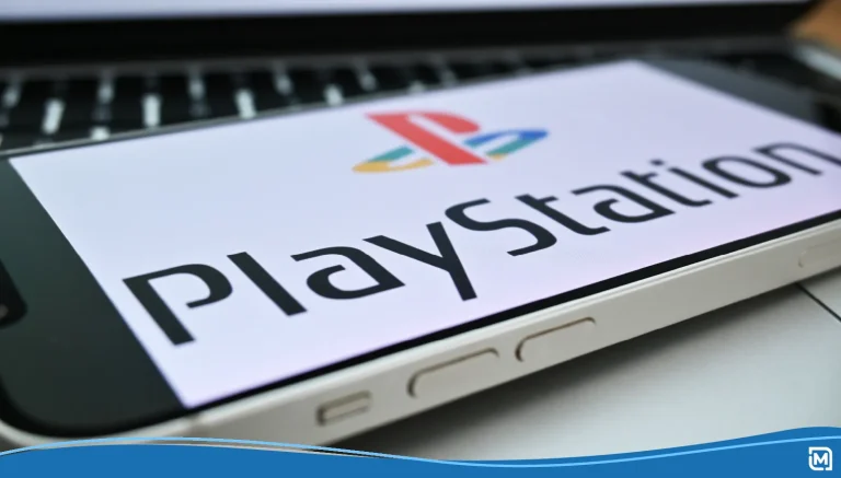 PlayStation logo on a PSP sitting on a desk