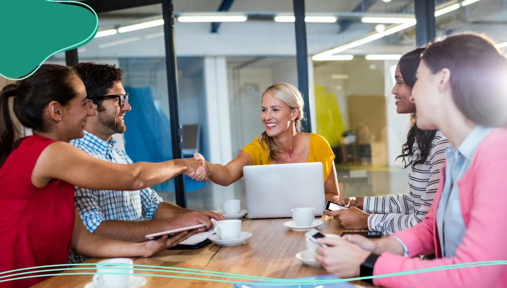 Casual business team giving handshake