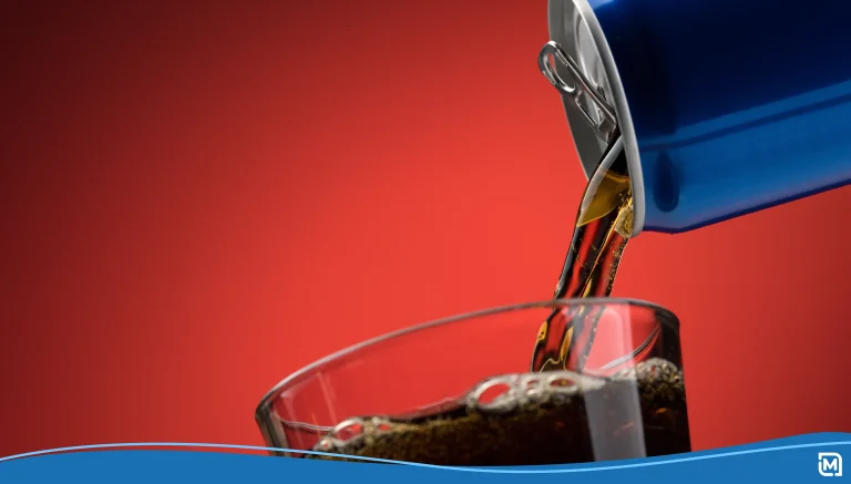 Pouring a soft drink in a glass