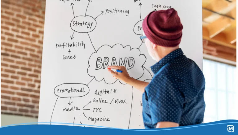 Man writing on a white poster mockup