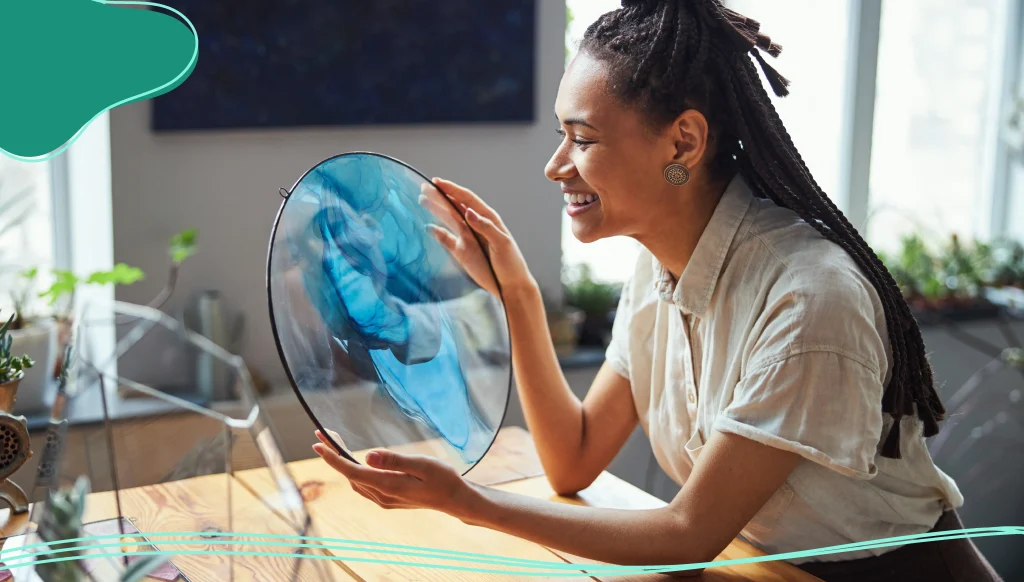 Happy female artist admiring her abstract artwork Stock Photo, ft. abstract & adult - Envato