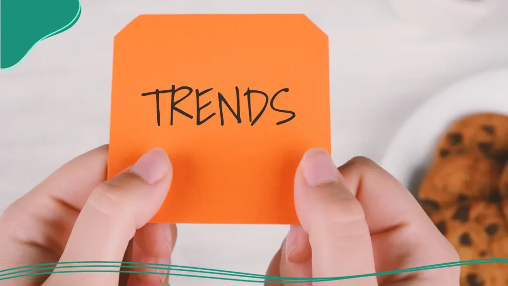 A person holding up a card that says trends