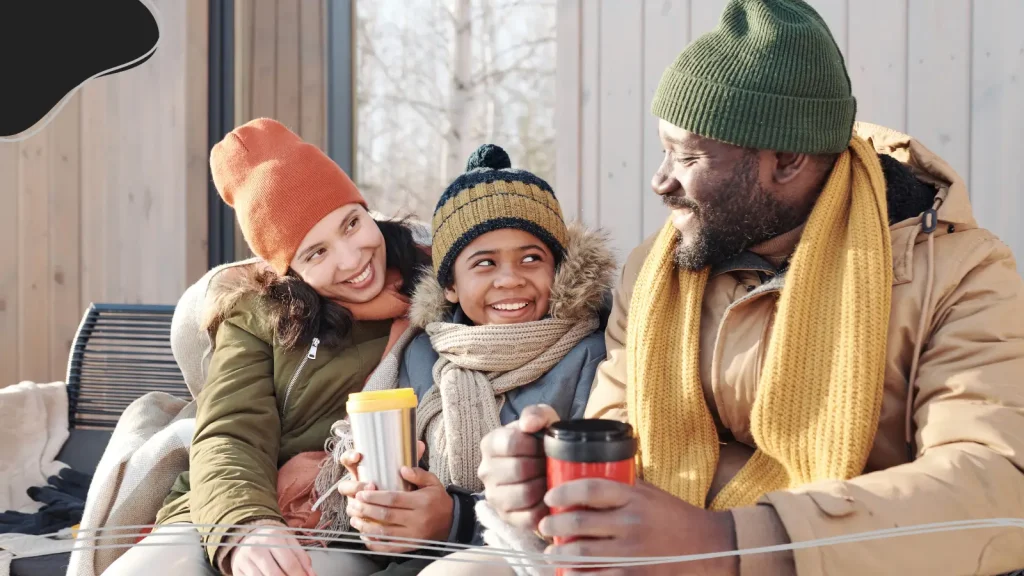 Family drinking warm drinks together