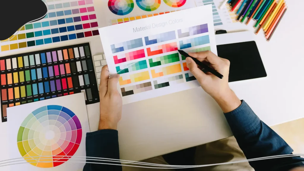 Person selecting a color from a chart