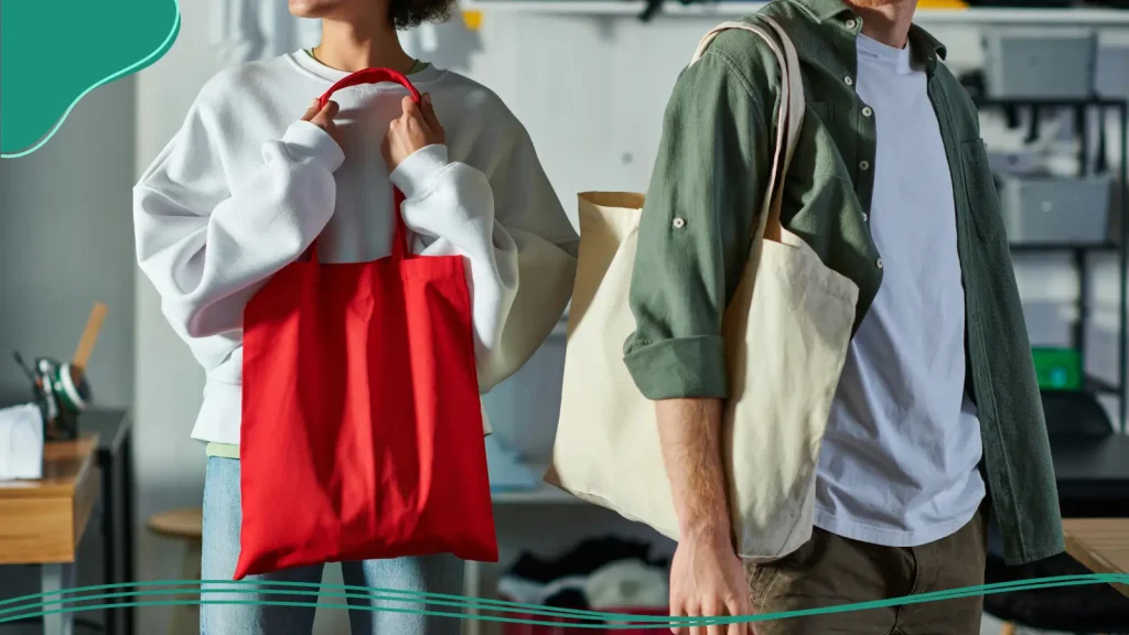 Two people carrying tote bags