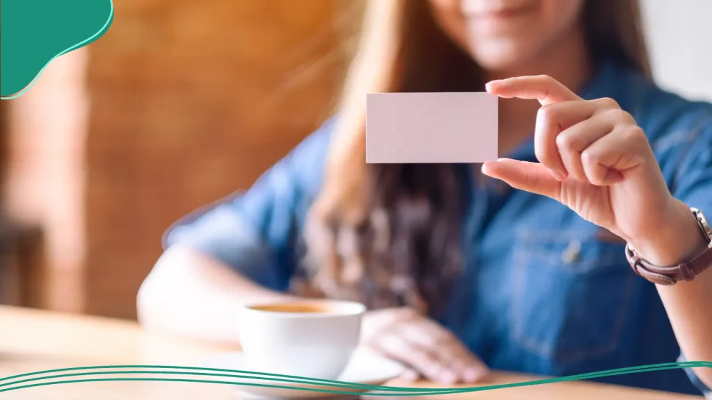 Woman looking at a business card