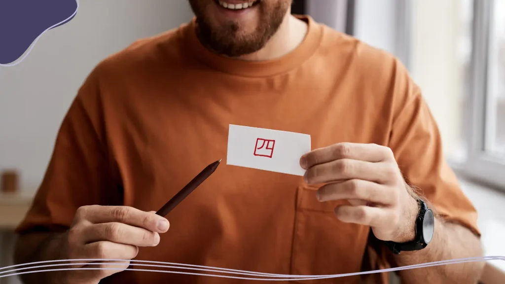 Man pointing to the back of a business card
