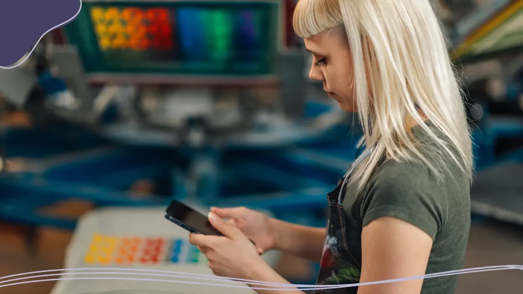 Woman preparing logo files for T-shirt printing