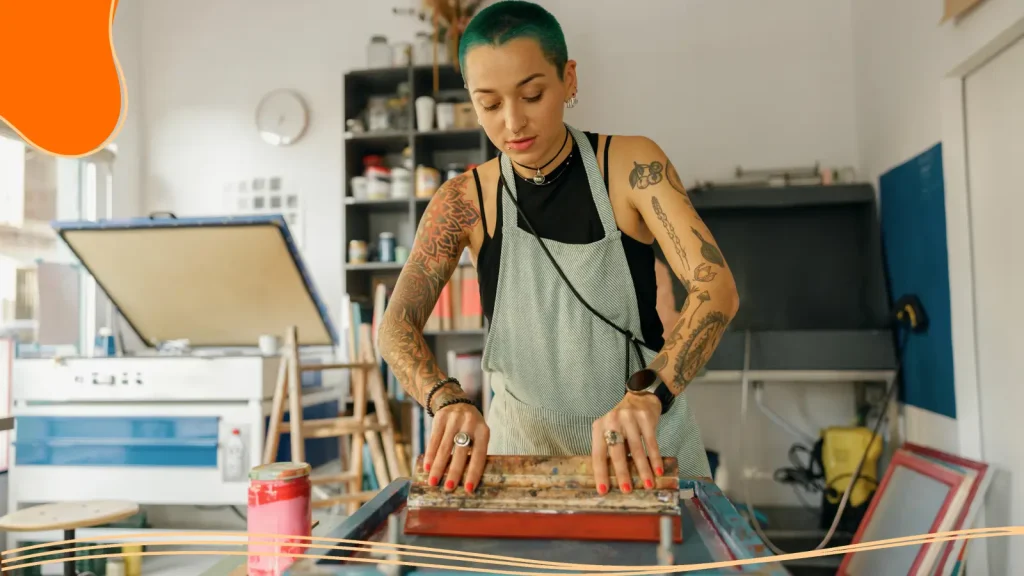 Woman screen-printing a T-shirt