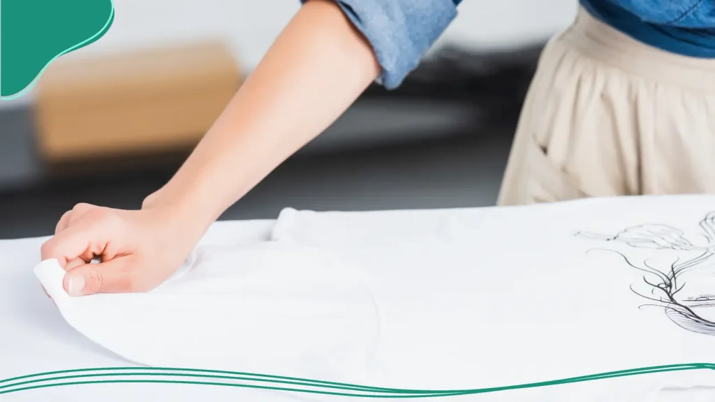 Woman folding a white T-shirt