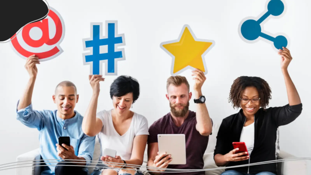 Four people check social media on tablets and smartphones as they work to strengthen their online brand identity.