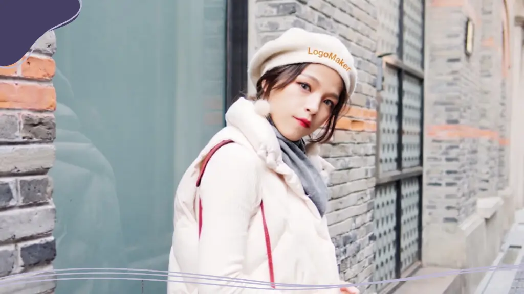 A young woman models a branded beret featuring a custom logo, a fun and stylish company swag idea for promotional merchandise.