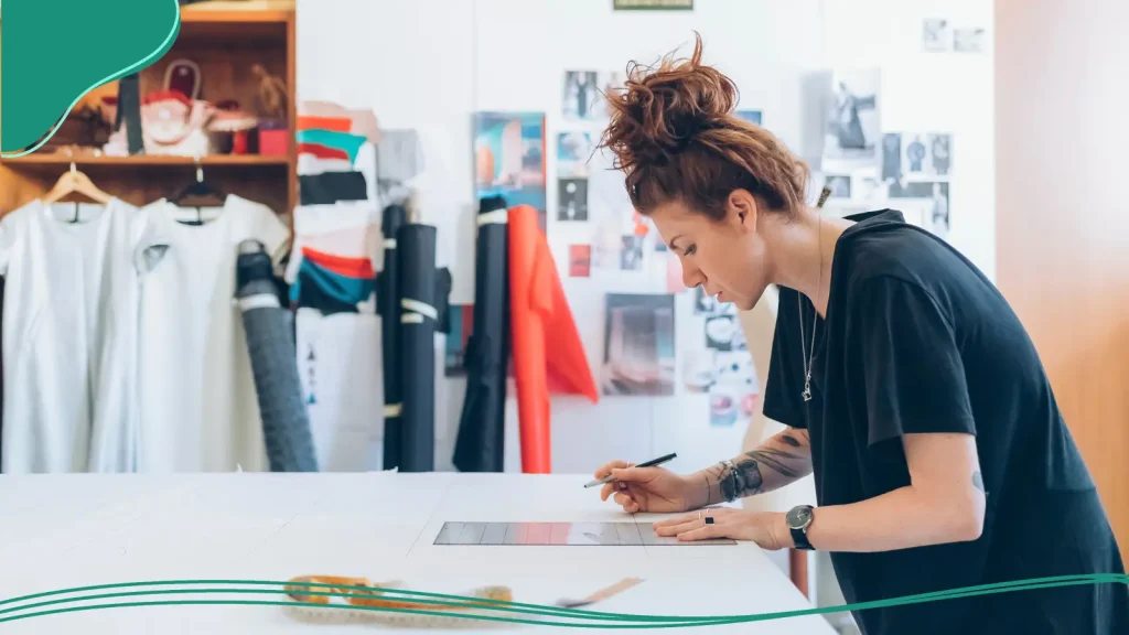 Woman working on her clothing logo design