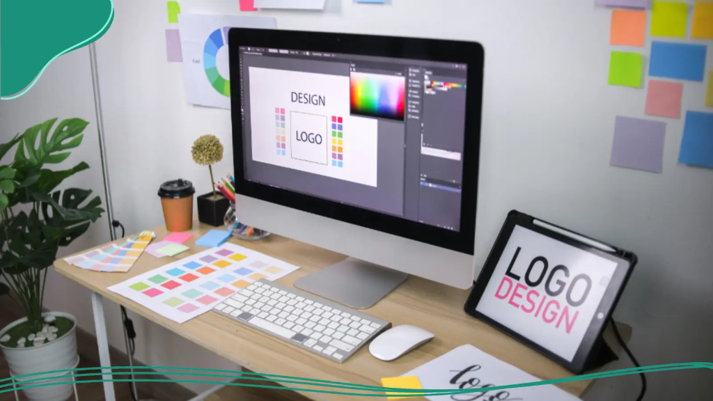 A desk and computer set up for someone learning how to create a logo with AI.