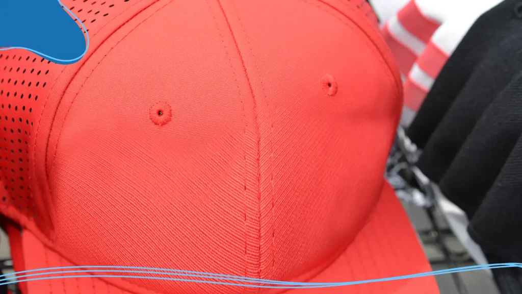 Front panel of a red baseball hat