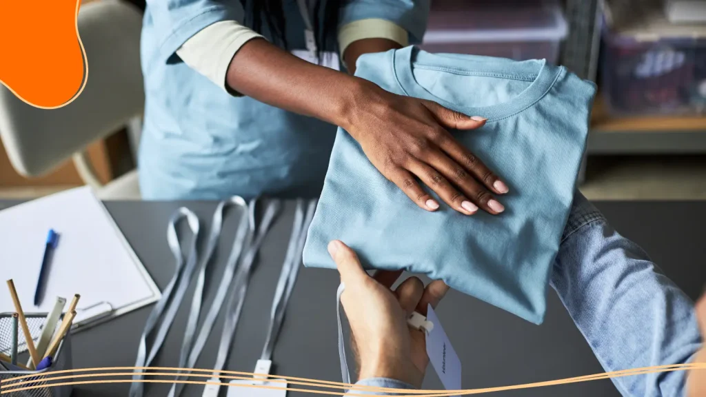 Person handing over a shirt